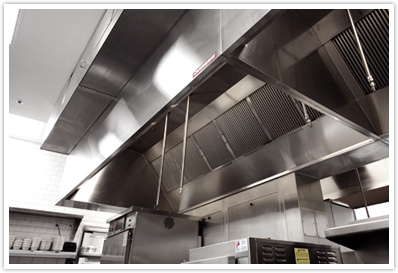 Upward view looking under a self-cleaning restaurant hood installation